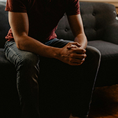 man sitting on a couch in therapy